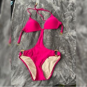 Hot pink Victoria’s Secret one piece open back bathing suit. Never worn.